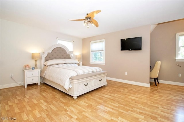 bedroom with ceiling fan and light hardwood / wood-style flooring