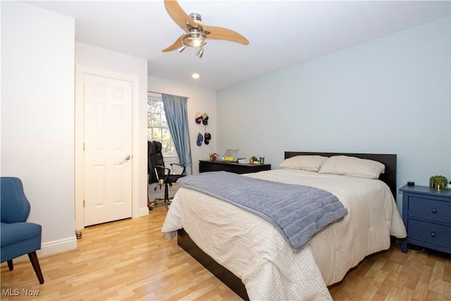 bedroom featuring light hardwood / wood-style floors and ceiling fan