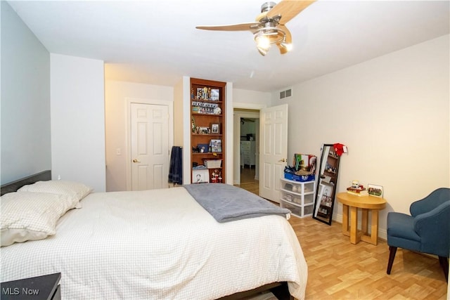 bedroom with ceiling fan and light wood-type flooring