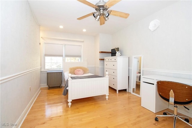 bedroom featuring ceiling fan and light wood-type flooring