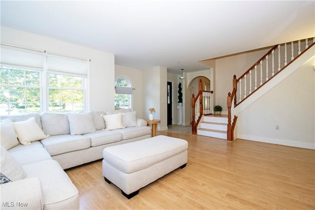 living room with light hardwood / wood-style flooring