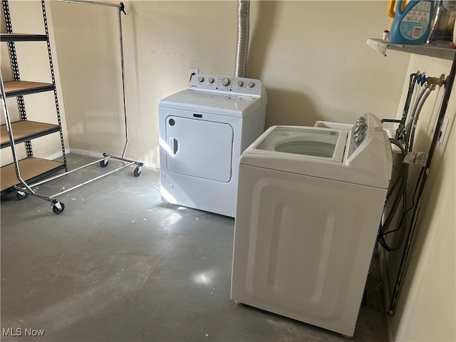 washroom with washer and dryer