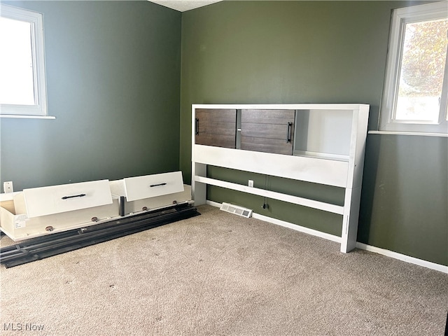 unfurnished bedroom featuring carpet floors