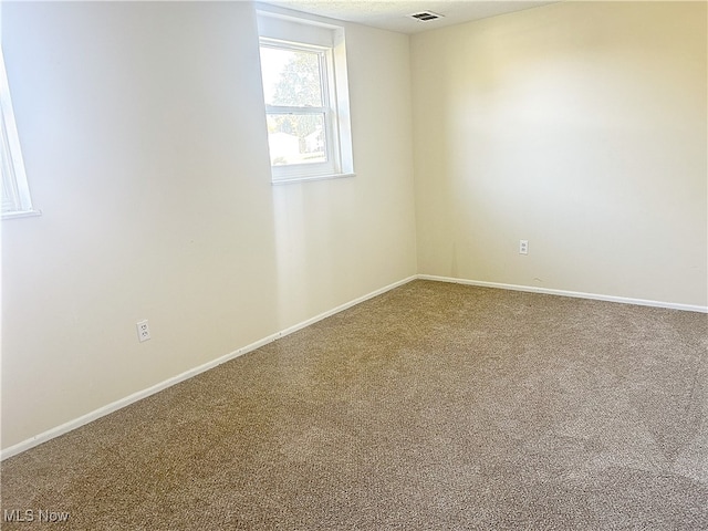 view of carpeted spare room