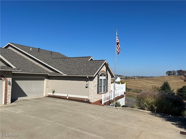 view of side of property with a garage