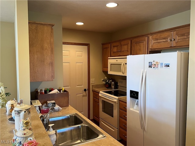 kitchen with sink and white appliances