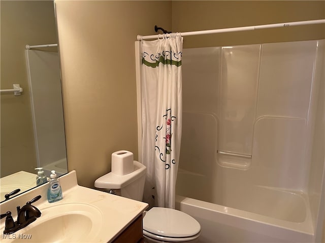 full bathroom with vanity, toilet, and shower / bath combo with shower curtain