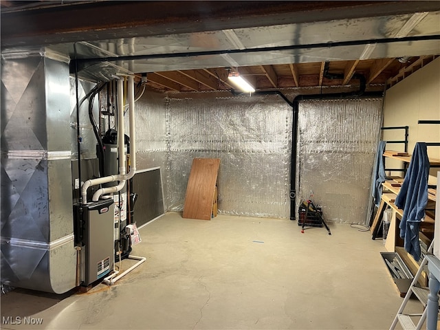 basement featuring heating unit