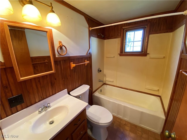 full bathroom with vanity, tub / shower combination, wooden walls, and toilet