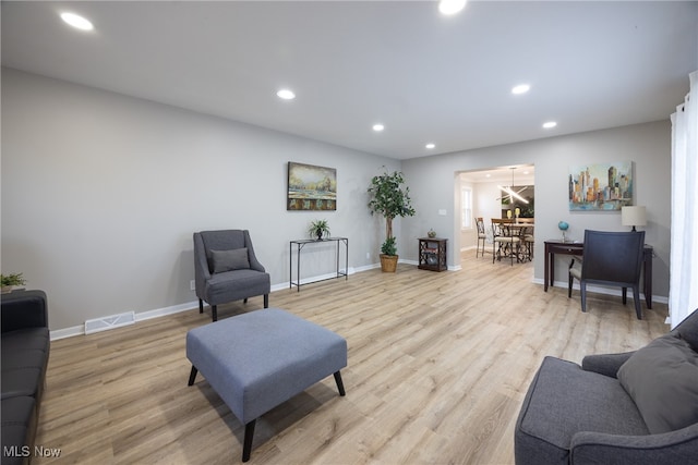 living room with light hardwood / wood-style flooring