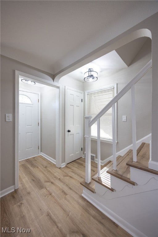 entryway with light hardwood / wood-style floors