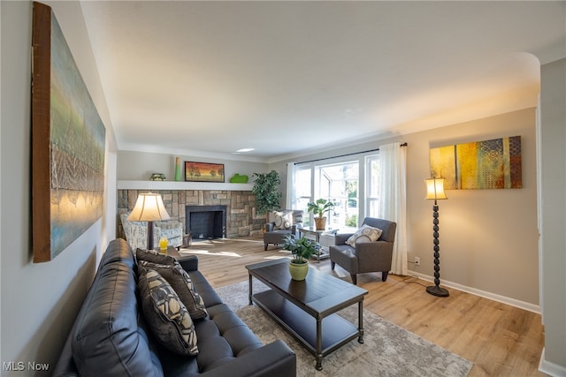 living room featuring hardwood / wood-style floors and a fireplace