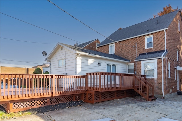 back of property featuring a deck