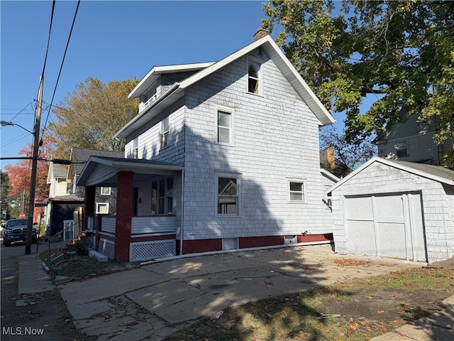 view of side of home with a shed