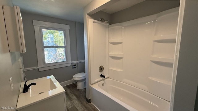 full bathroom featuring vanity, toilet, shower / bathing tub combination, and hardwood / wood-style floors