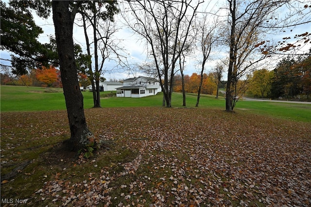 surrounding community featuring a lawn