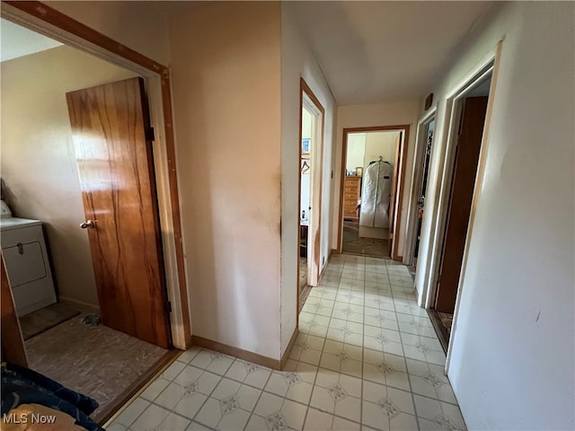 hallway with washer / clothes dryer