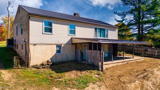 back of property with a patio and cooling unit