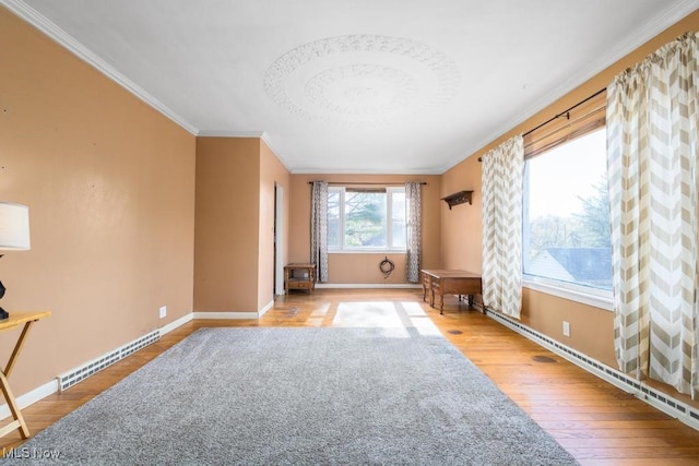 living room with crown molding and hardwood / wood-style flooring