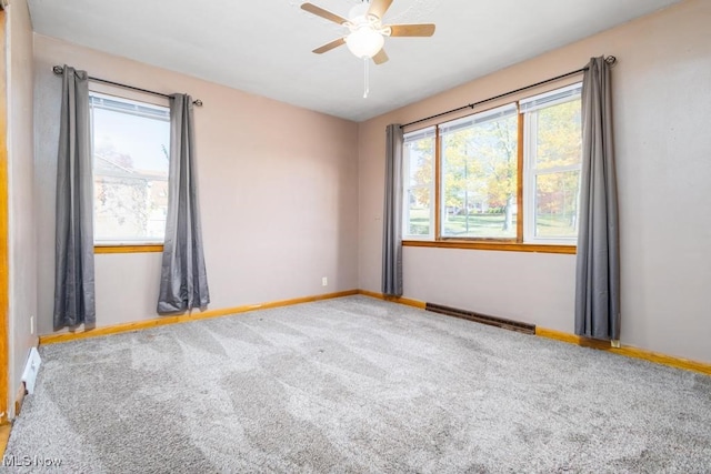 carpeted empty room with ceiling fan