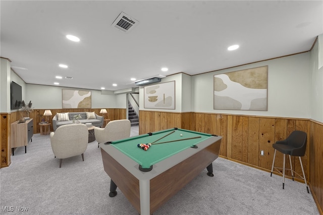 recreation room featuring light carpet, wooden walls, and billiards