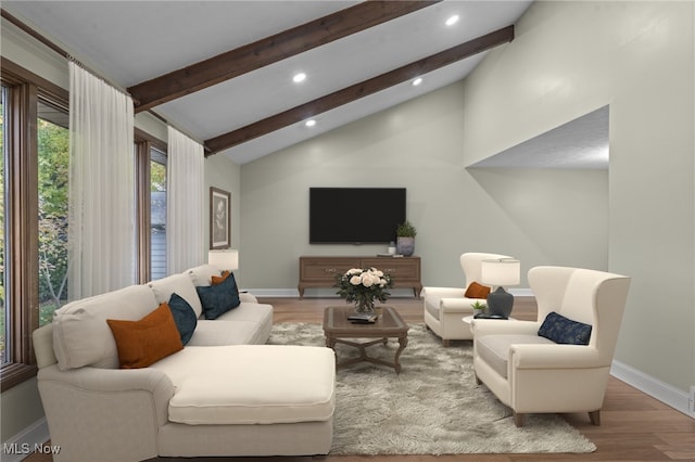 living room with beamed ceiling, hardwood / wood-style flooring, and high vaulted ceiling