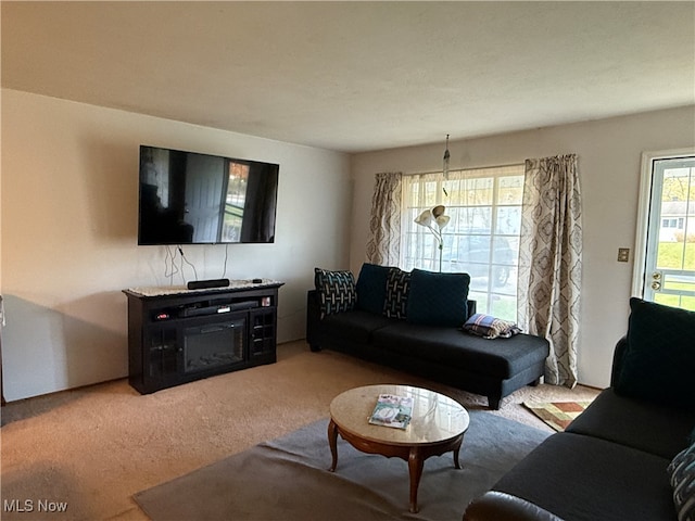 living room featuring light carpet