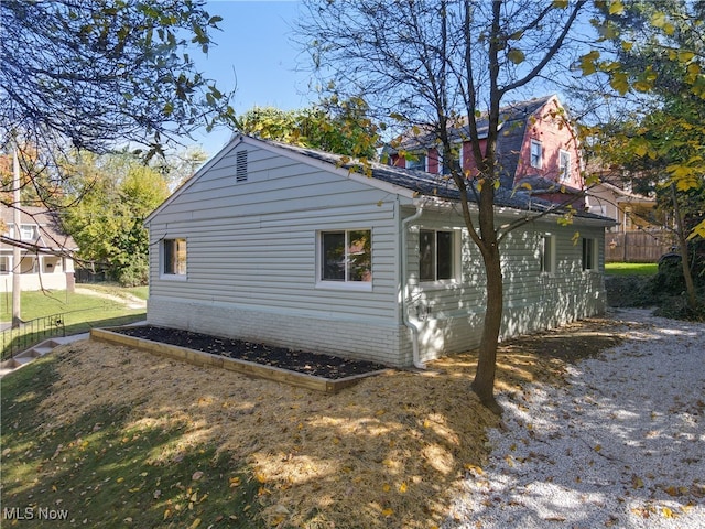 view of home's exterior with a yard