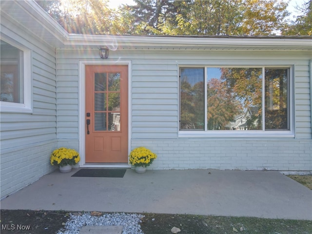 property entrance with a patio area