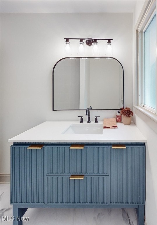 bathroom with a wealth of natural light and vanity