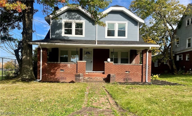 view of front of house featuring a porch and a front yard