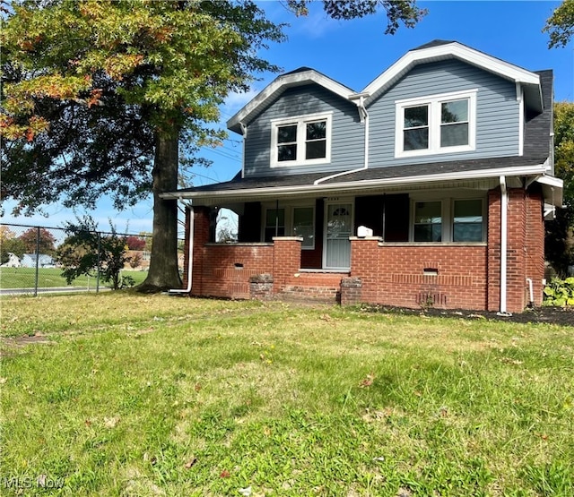 view of front facade with a porch and a front lawn