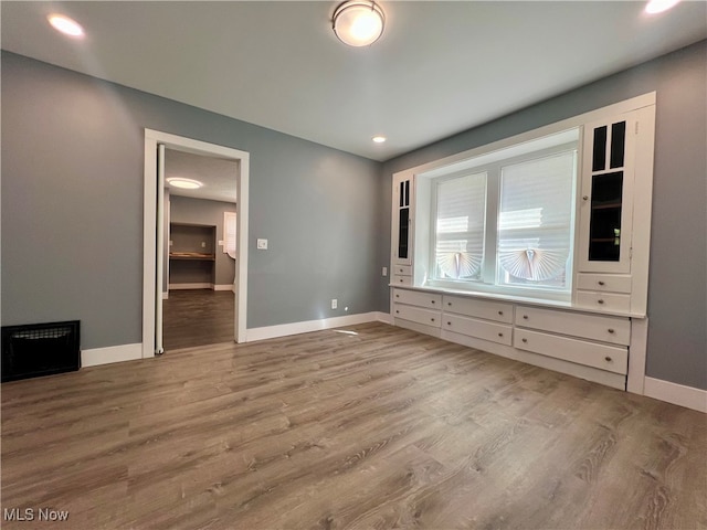 unfurnished bedroom featuring light wood-type flooring