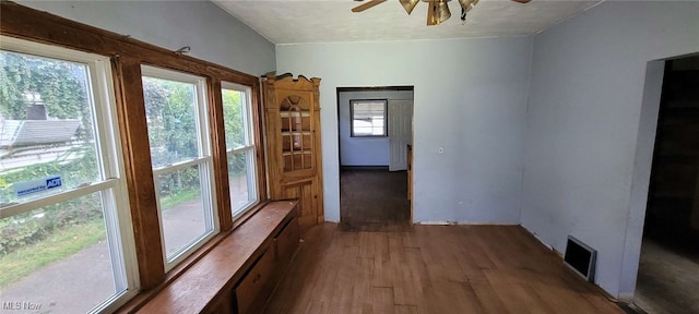 doorway featuring hardwood / wood-style flooring and ceiling fan