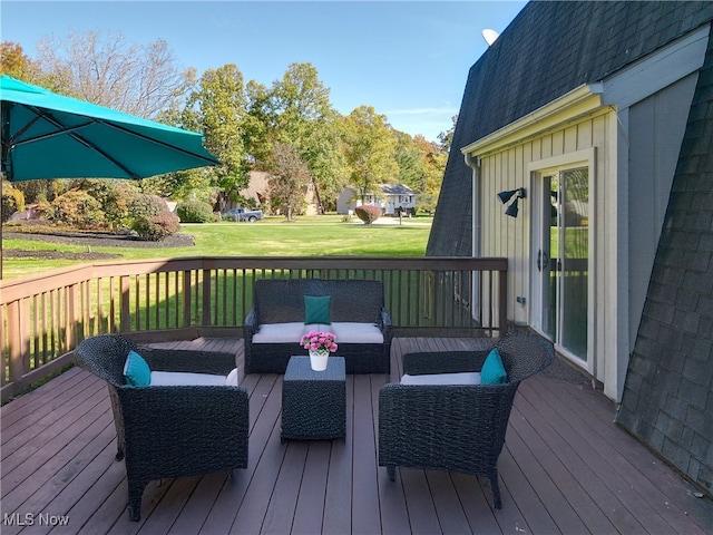 wooden deck with a yard and an outdoor hangout area