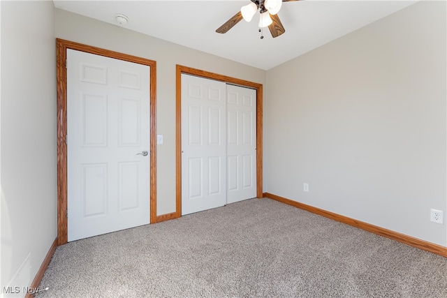 unfurnished bedroom featuring carpet, a closet, and ceiling fan