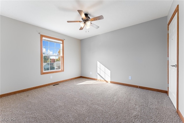 carpeted empty room with ceiling fan