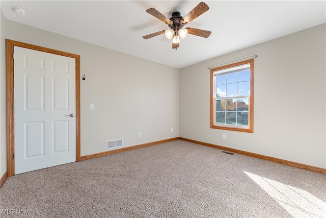 carpeted empty room with ceiling fan