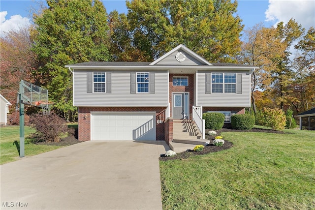 raised ranch with a garage and a front lawn