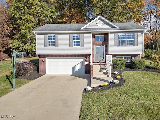 split foyer home with a front yard and a garage