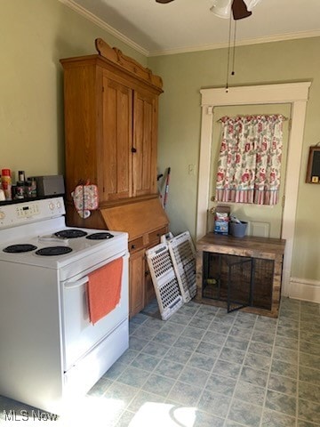 kitchen featuring ceiling fan, crown molding, and white electric stove