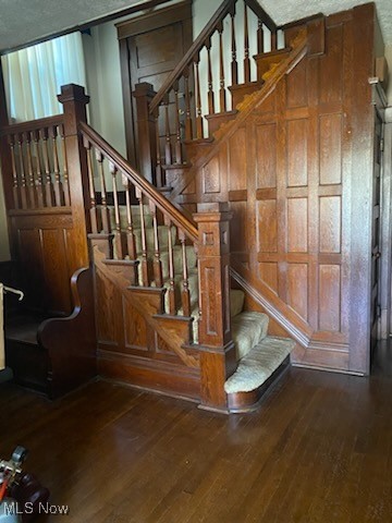 stairs with hardwood / wood-style floors