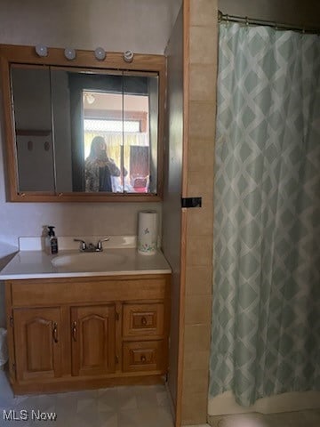 bathroom featuring vanity and walk in shower