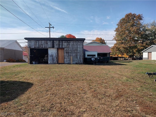 view of pole building with a yard