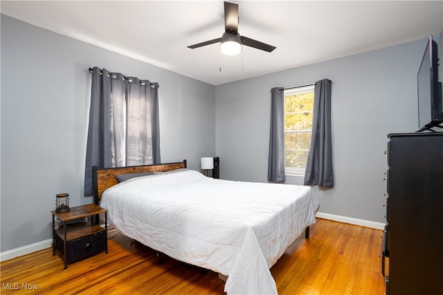 bedroom featuring ceiling fan and light hardwood / wood-style flooring