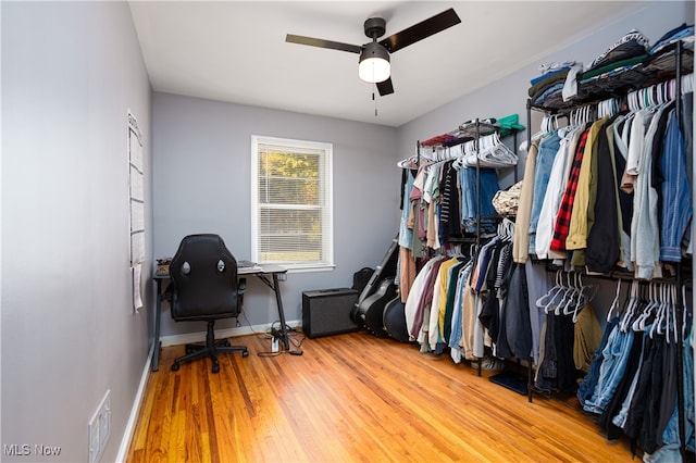 spacious closet with wood-type flooring and ceiling fan