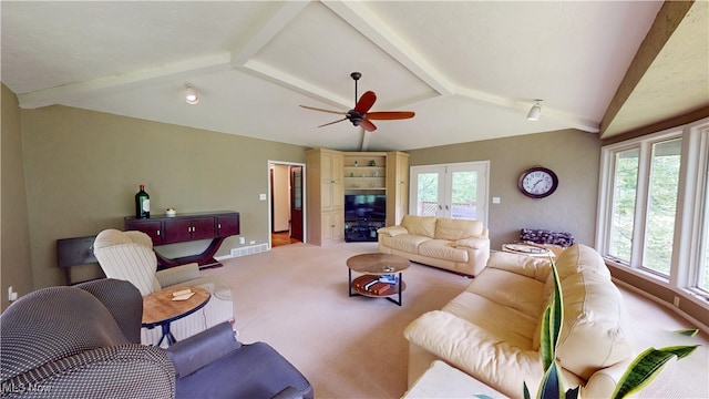 living room with ceiling fan, a wealth of natural light, and light colored carpet