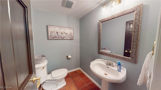 bathroom featuring toilet and sink