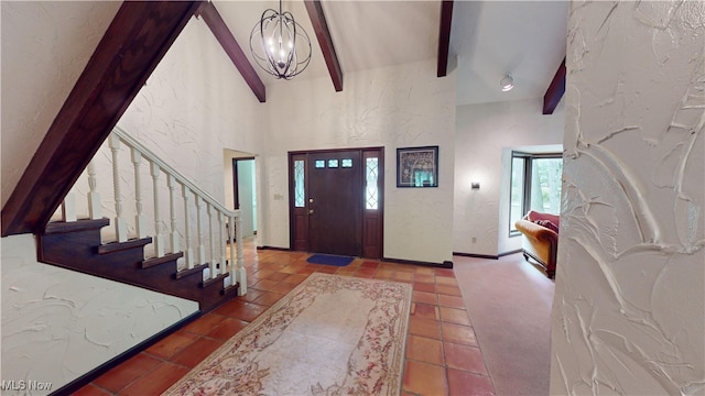 entryway featuring beam ceiling, tile patterned floors, high vaulted ceiling, and plenty of natural light