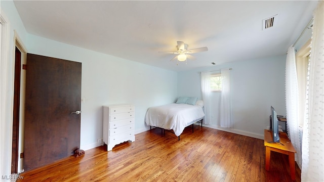 unfurnished bedroom featuring light hardwood / wood-style flooring and ceiling fan